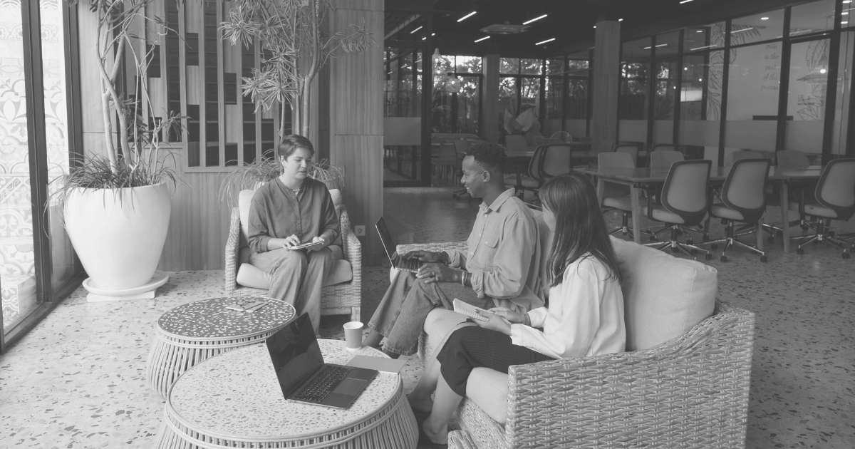 Group of freelancers gathered around a table, symbolizing networking.